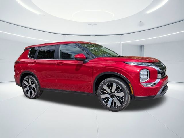 2026 Mitsubishi Outlander SE in Red Diamond — front three-quarter view